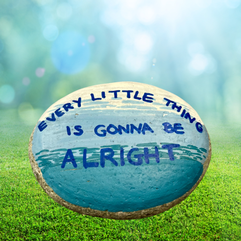 kindness rock painted with "every little thing is gonna be alright"