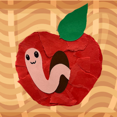 a red apple with a green leaf, made from torn pieces of construction paper, with a small smiling worm coming out of the apple, all on a background that looks like a brown wicker basket