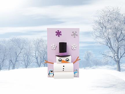 rolled snowman in snowy landscape